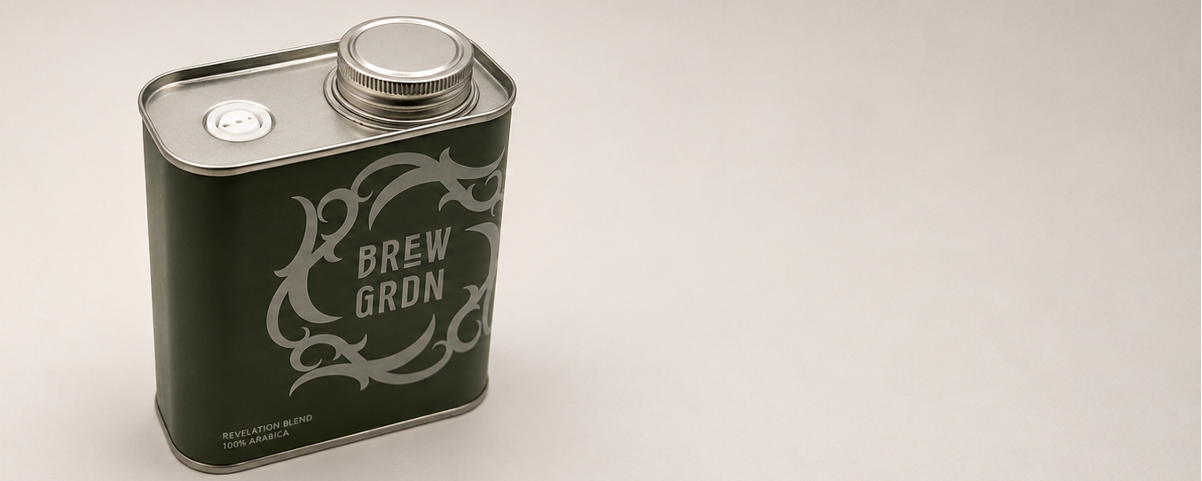 A square metal coffee can with a silver screw cap, featuring a dark green body with a silver 'BREW GARDEN' logo and decorative swirls, set against a plain light gray background.