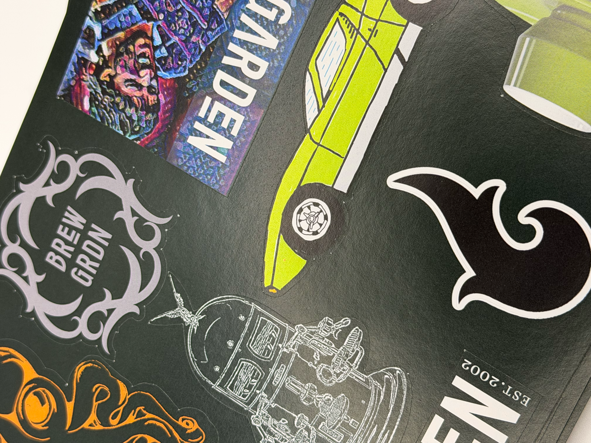 Close-up of a green product packaging with various graphics and text