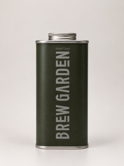 A dark olive green metal canister with a silver screw cap, featuring the brand name 'BREW GARDEN' printed vertically in light gray on the front, set against a plain light gray background.