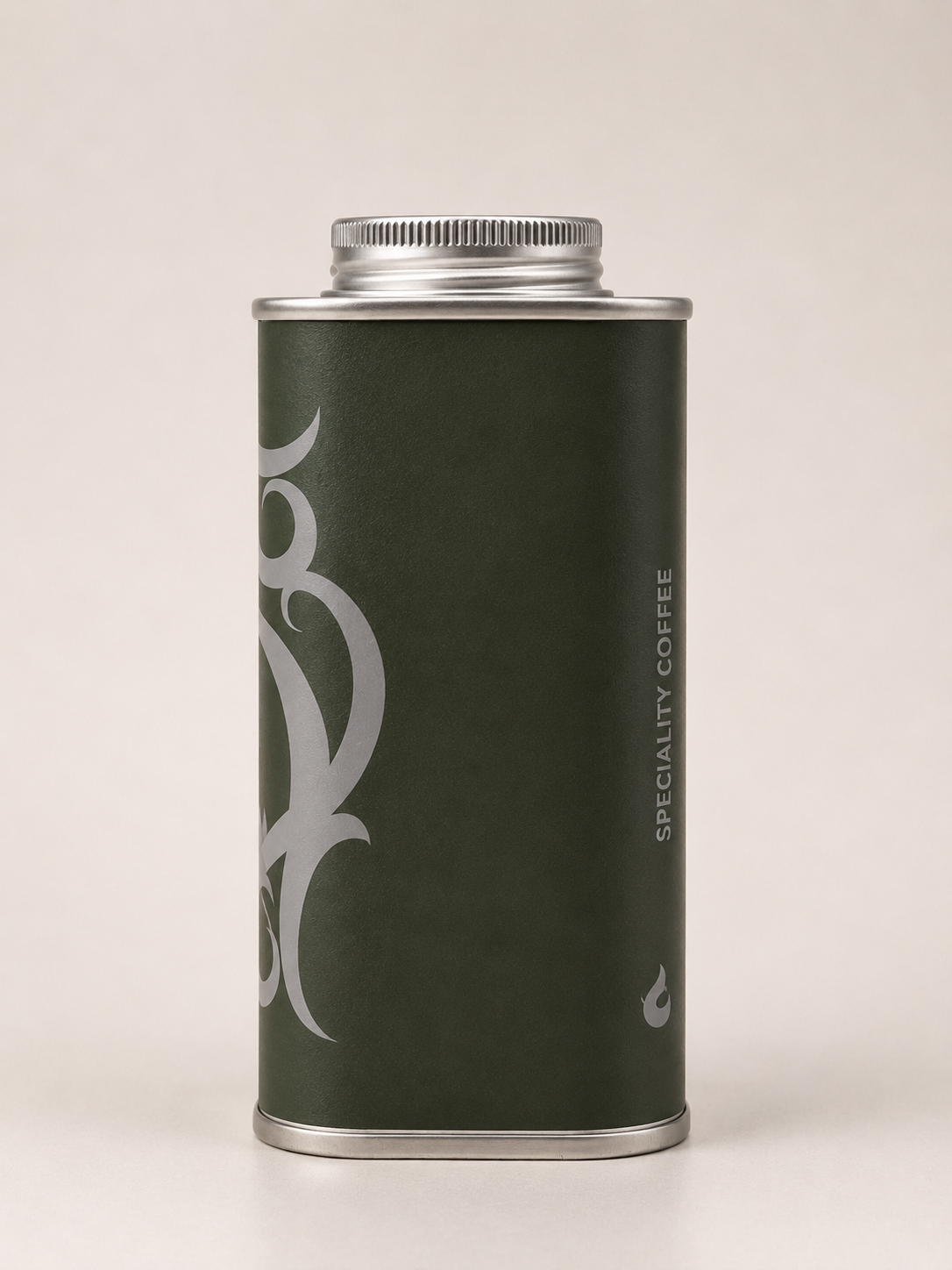 A dark green cylindrical metal canister with a silver screw-top lid, featuring a large white stylized graphic on the front and vertical text reading 'SPECIALTY COFFEE' on the side, photographed against a plain light beige background.